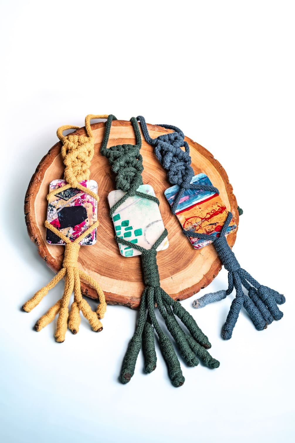 Artistic amulet with colorful fragment and special weaving