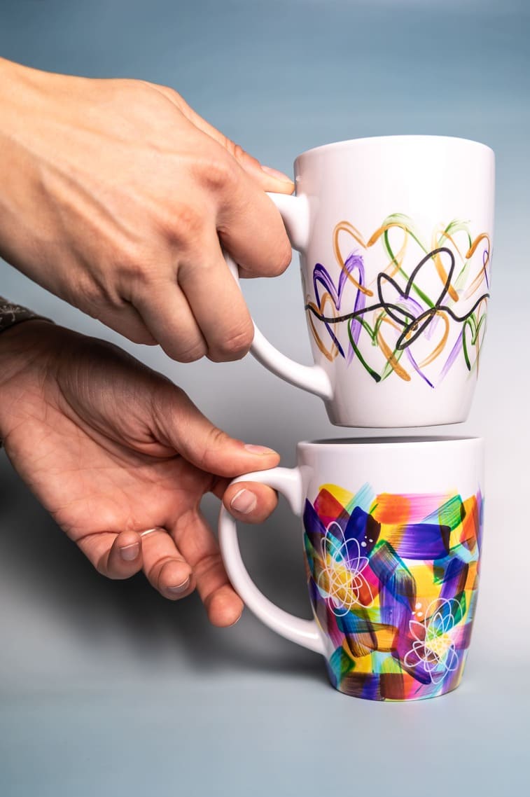 Hand-painted ceramic mug with abstract motifs