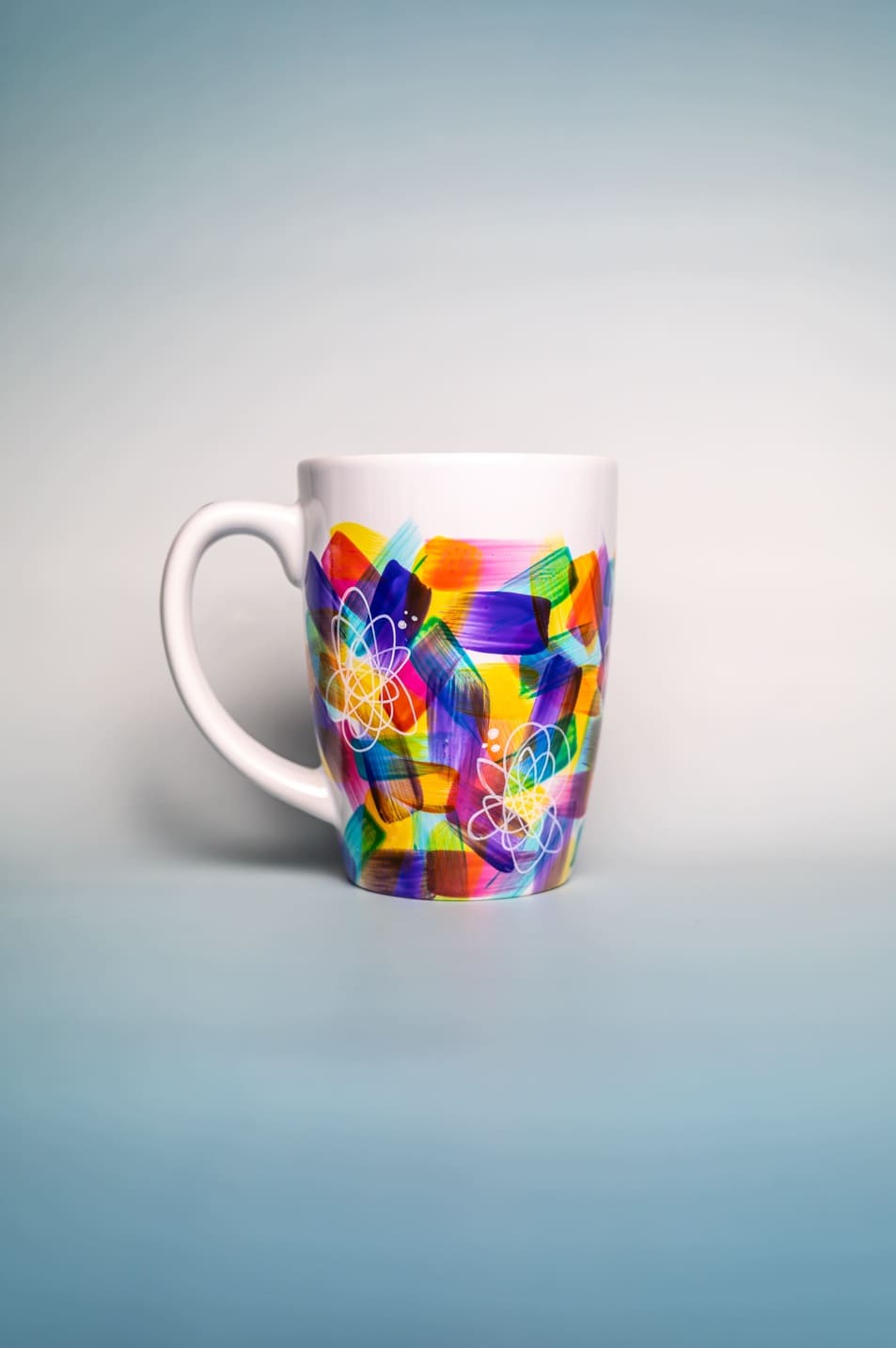 Artistic mug with vibrant colors and unique design